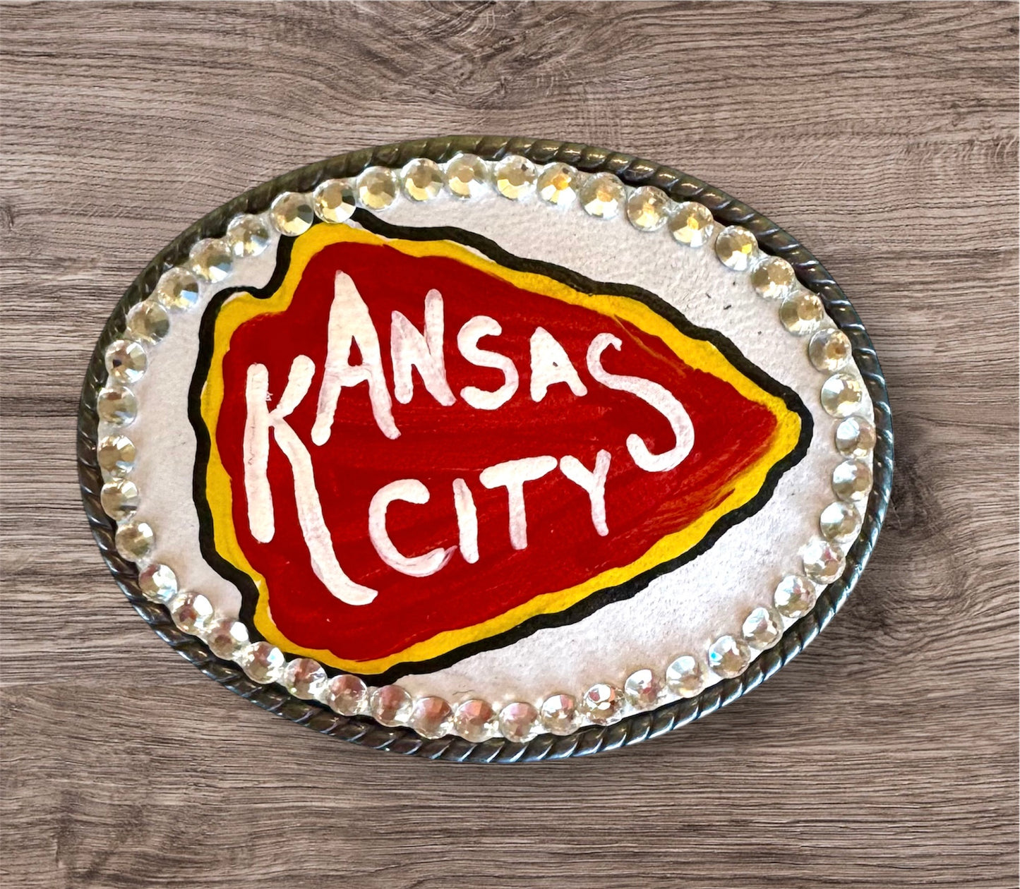 White arrowhead belt buckle