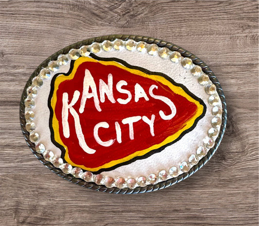 White arrowhead belt buckle